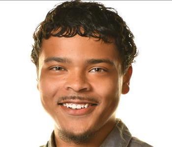 young man with dark hair and facial hair