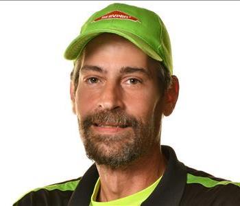 SERVPRO employee in front of white background