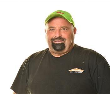 SERVPRO employee in front of white background